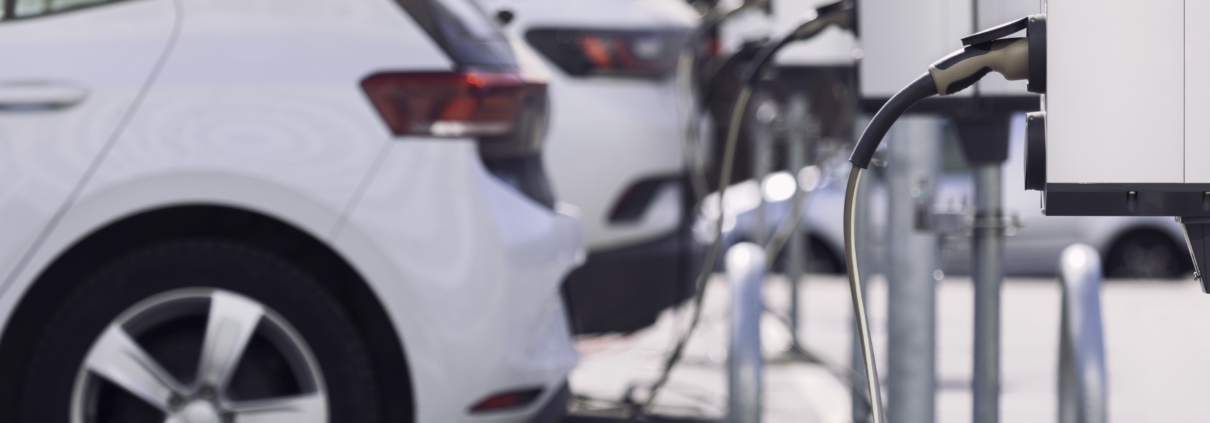 A parking lot with charging stations for electric cars.