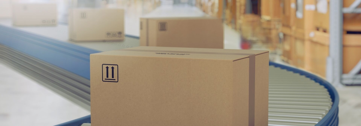 Logistics package on conveyor in warehouse.