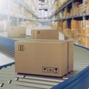 Logistics package on conveyor in warehouse.