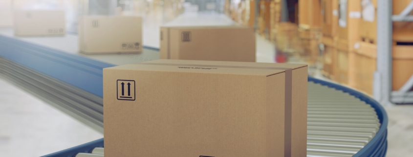 Logistics package on conveyor in warehouse.